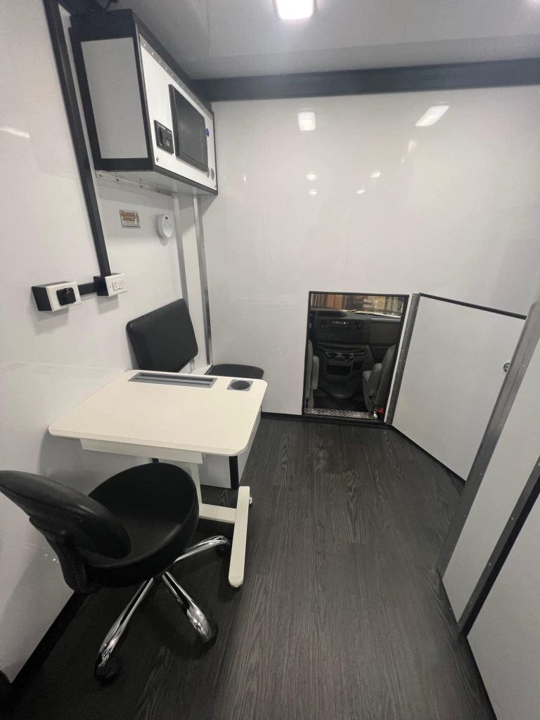 Magnum-Mobile-26ft-Mobile-Dental-Clinic-Professional-Series-Pass-Thru-Door-Open-8