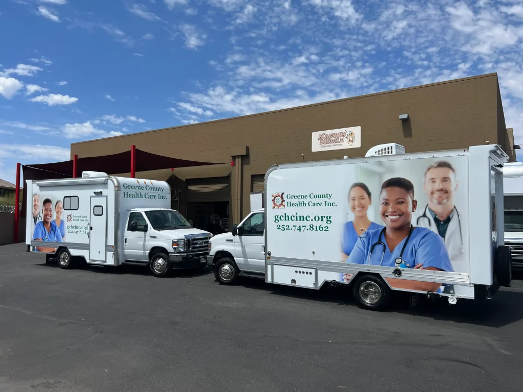 two mobile medical clinics at magnum mobile
