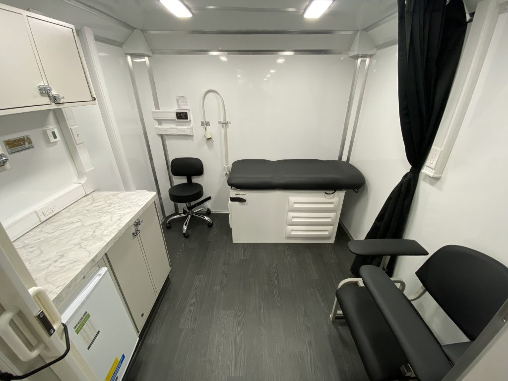 Interior of a custom mobile medical clinic with exam room